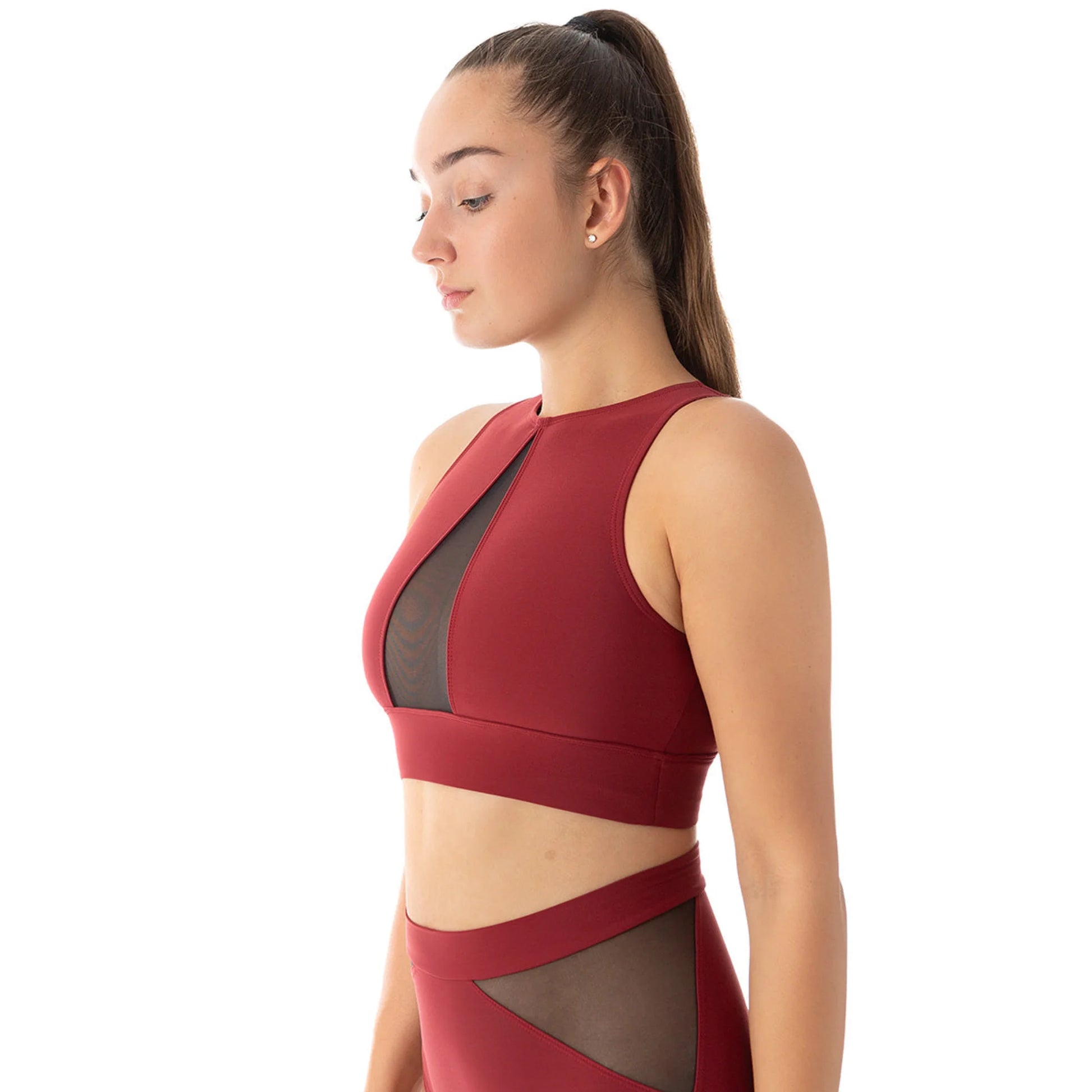 Femme de côté portant une brassière couleur bordeaux pour la pole dance de marque dragonfly